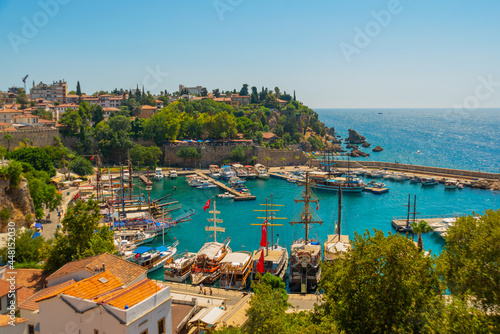 ANTALYA, TURKEY: The old harbor in Antalya and the port with ships and boats on a sunny summer day.