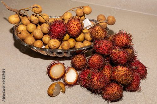 Exotic fruits Chom Chom (Rambutan) and Dimocarpus longan, commonly known as the longan. Native fruit to tropical Asia and China.