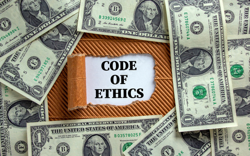 Code of ethics symbol. Words 'Code of ethics' appearing behind torn brown paper. Beautiful background from dollar bills. Business, code of ethics concept, copy space.