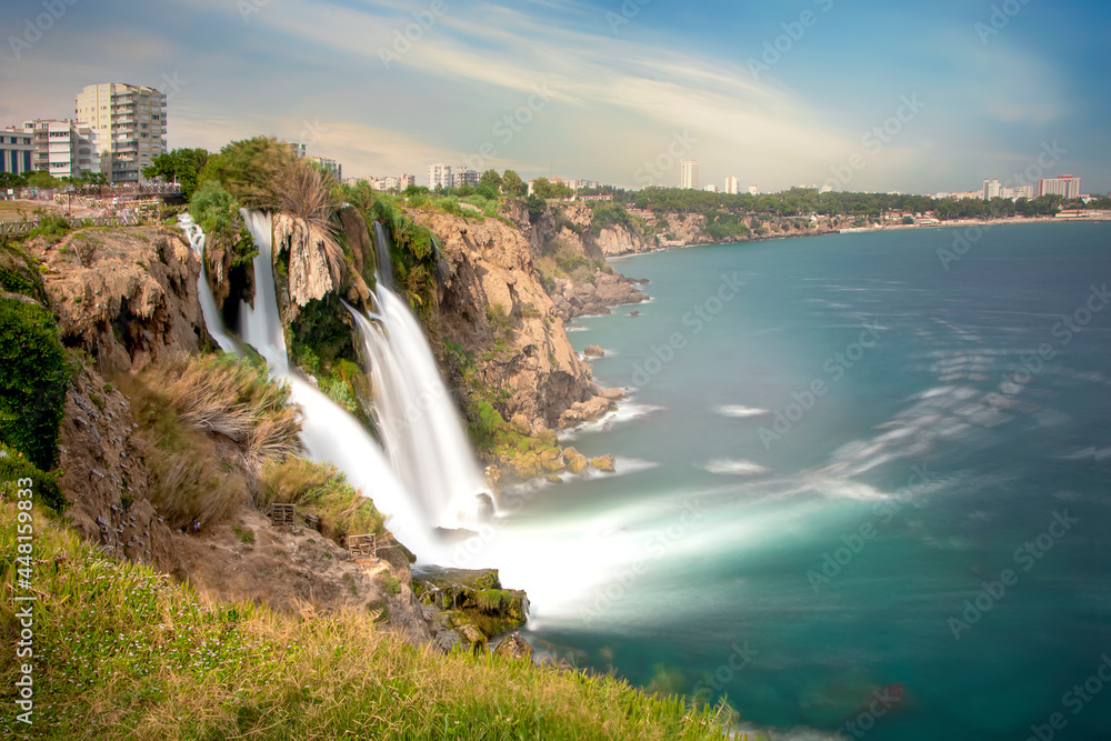 Waterfall Duden at Antalya, Turkey. Duden Falls and sea cliffs. River Duden in Antalya. nature travel background Waterfall Duden at Antalya, Turkey. Duden Falls and sea cliffs. River Duden in Antalya. nature travel background