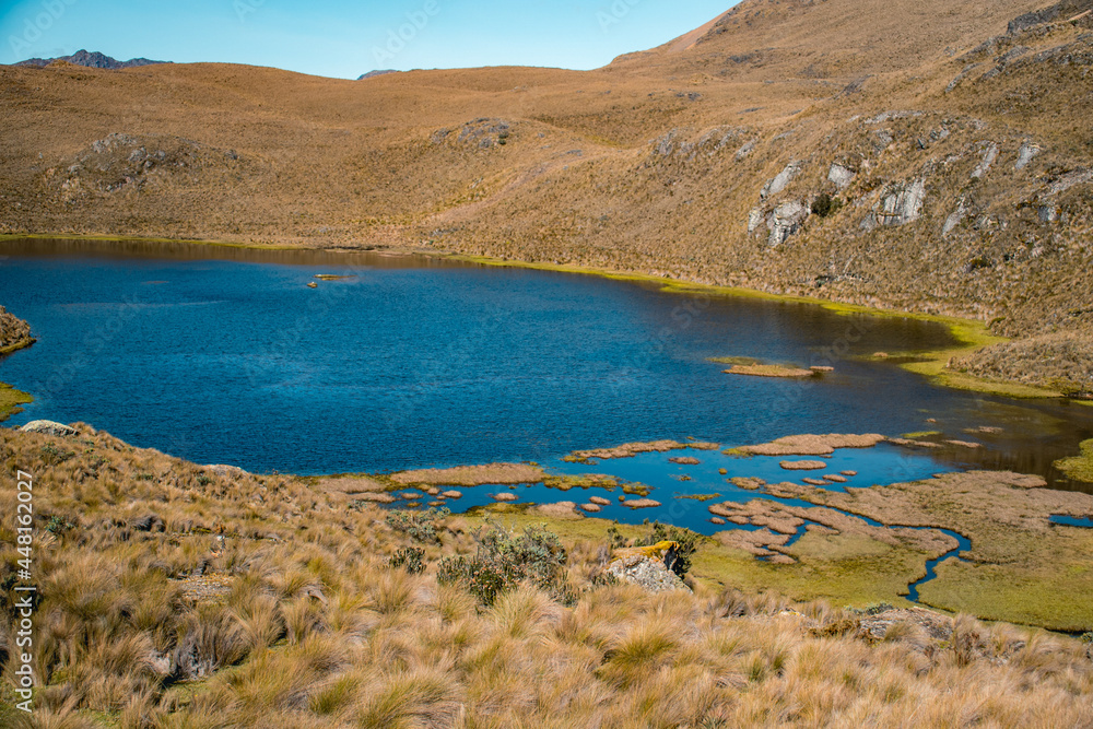 El Cajas National Park on a sunny morning overlooking a beautiful lagoon.