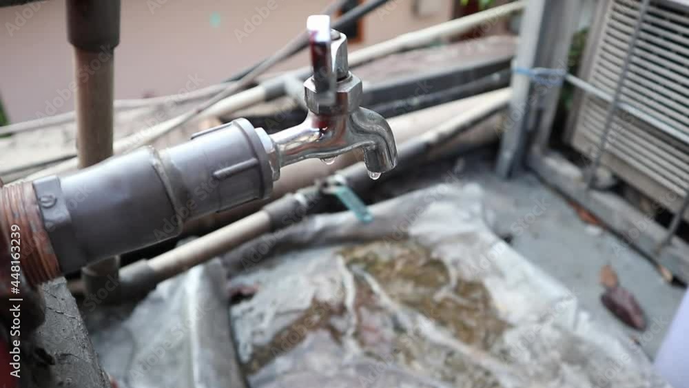 water dripping from the faucet water dripping from the faucet