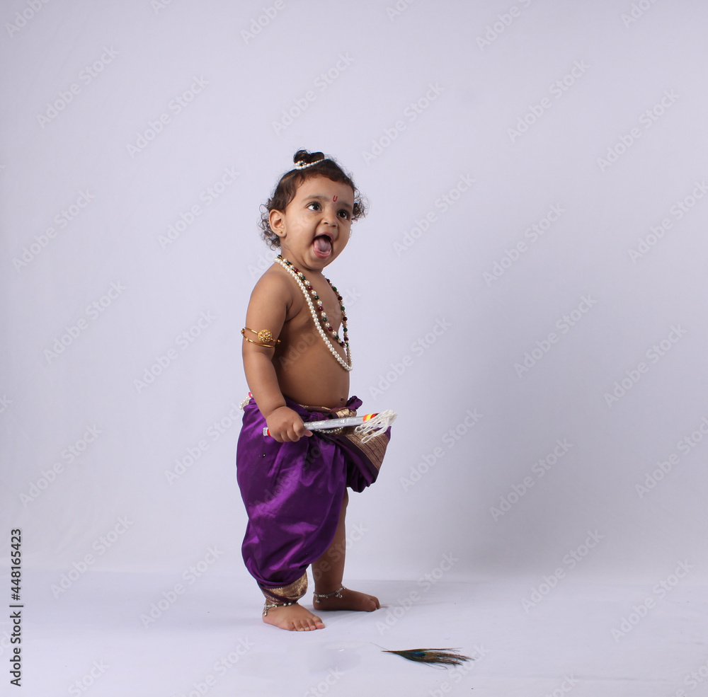 adorable Indian baby in krishna kanha or kanhaiya dress posing ...