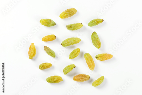Dried fruits, green raisins isolated on white background.