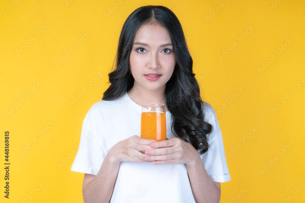 Beautiful beauty Asian woman cute girl feel happy drinking orange juice for good health on white background - lifestyle beauty woman healthy concept Beautiful beauty Asian woman cute girl feel happy drinking orange juice for good health on white background - lifestyle beauty woman healthy concept