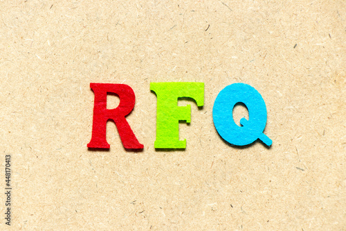 Color cloth alphabet letter in word RFQ (abbreviation of request for quotation) on wood background photo