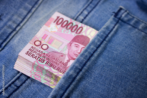 rupiah money inside of jeans pocket indonesia currency