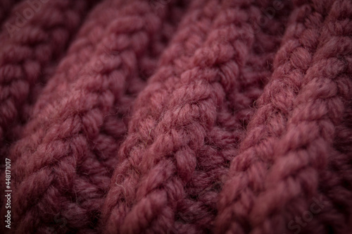 Close-up of the texture of a handmade knitted sweater. Rows of loops.