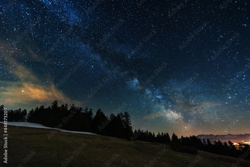 Bright starry sky with the milky way on the background of High Tatras mountains 