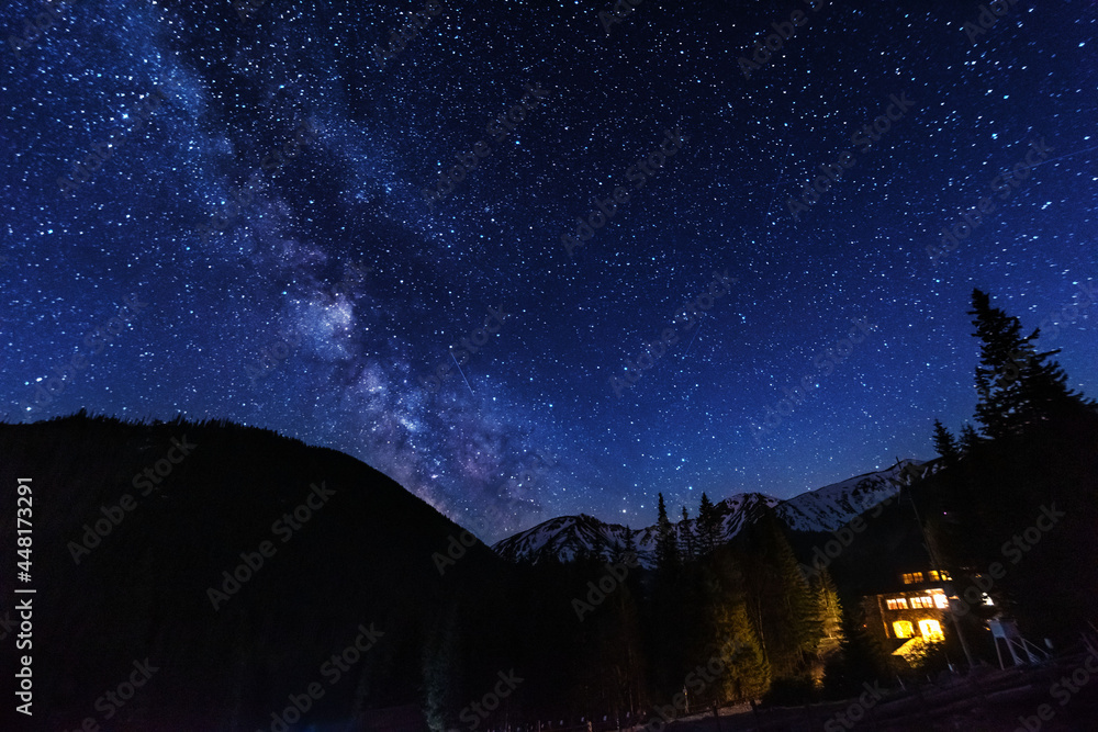 Bright starry sky with the milky way on the background of High Tatras mountains Bright starry sky with the milky way on the background of High Tatras mountains