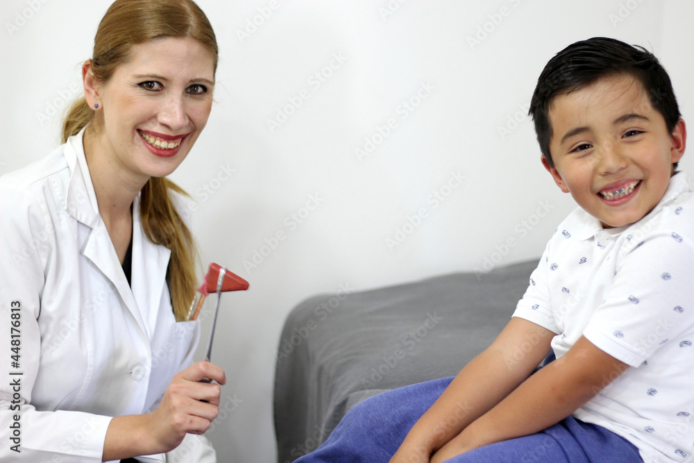 Female pediatrician doctor examining a 7-year-old Latino boy in her office
Female pediatrician doctor examining a 7-year-old Latino boy in her office