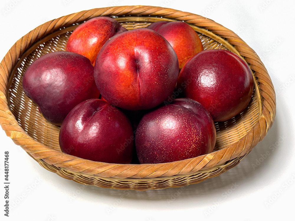 Sweet red nectarines in a bamboo basket Sweet red nectarines in a bamboo basket