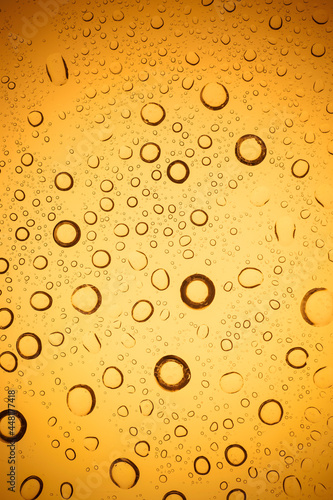 Yellow water droplets background.