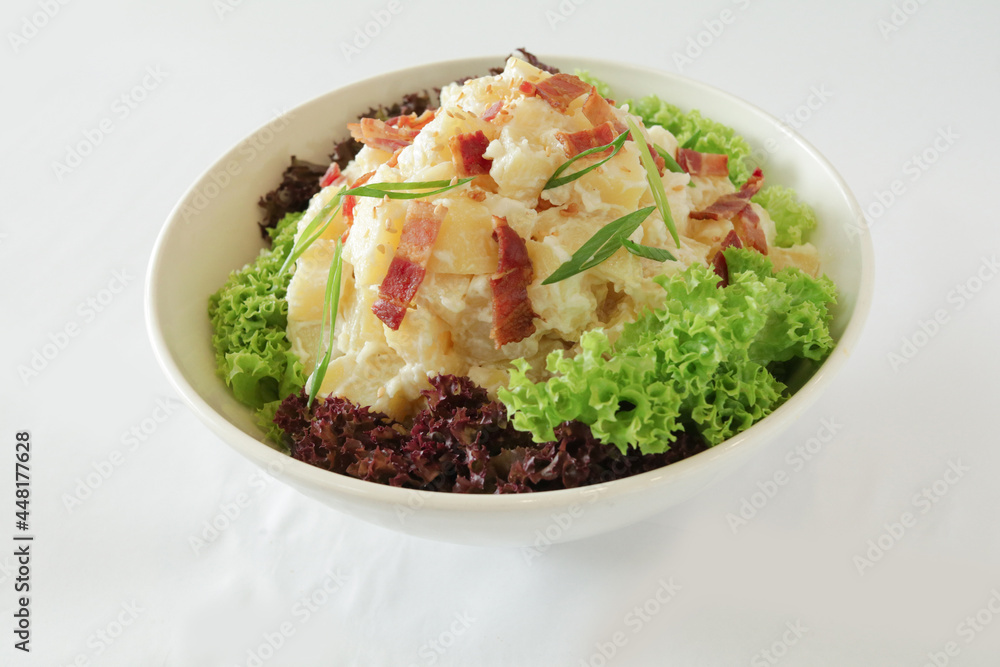 potato salad with bacon and tartar sauce in white background Christmas festival menu potato salad with bacon and tartar sauce in white background Christmas festival menu