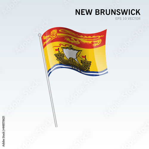 Waving flag of New Brunswick provinces of Canada isolated on gray background