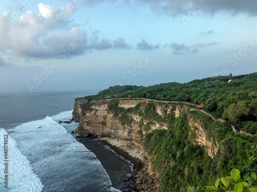 Sunset from the Pura Uluwatu temple on Bali island in Indonesia. - stock photo