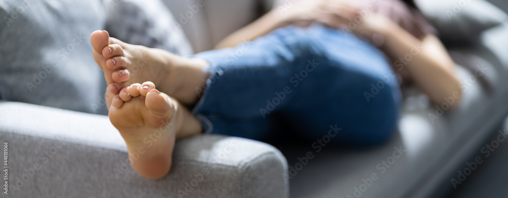 Stinky Feet Resting On Couch. Foot Smell - obrazy, fototapety, plakaty 
