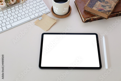 Mock up digital tablet and stylus pen on white office desk.
