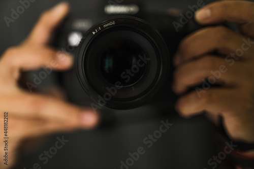 Close up of hand holding camera