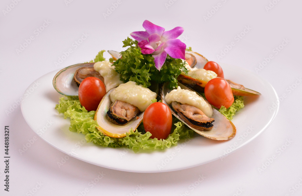 bbq baked cheese muscle on shell seafood with vegetable salad in white background for Christmas festival menu bbq baked cheese muscle on shell seafood with vegetable salad in white background for Christmas festival menu