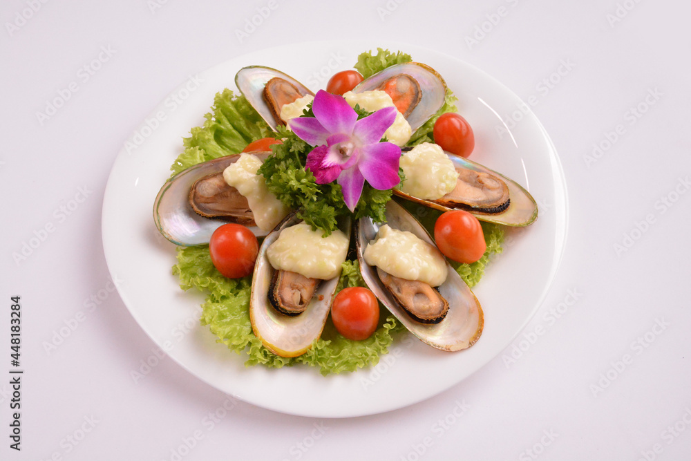 bbq baked cheese muscle on shell seafood with vegetable salad in white background for Christmas festival menu bbq baked cheese muscle on shell seafood with vegetable salad in white background for Christmas festival menu
