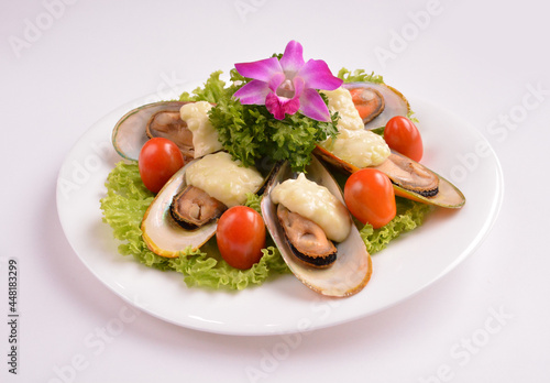 bbq baked cheese muscle on shell seafood with vegetable salad in white background for Christmas festival menu