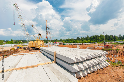 piles lie on the construction site in the summer