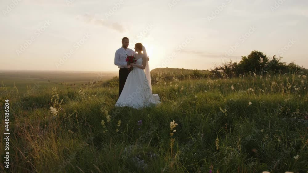 Attractive man walks to bride and starts to hug her Attractive man walks to bride and starts to hug her