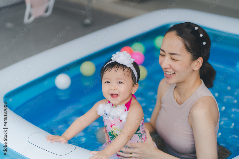 baby and mom happy time in swimming pool by play and learning of baby ...