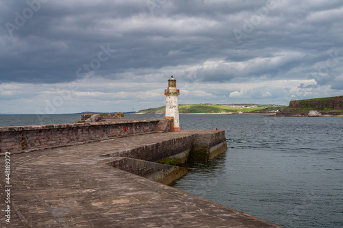 The West Pier and the West Pier Lighthouse in Whitehaven, Cumbria, England, UK