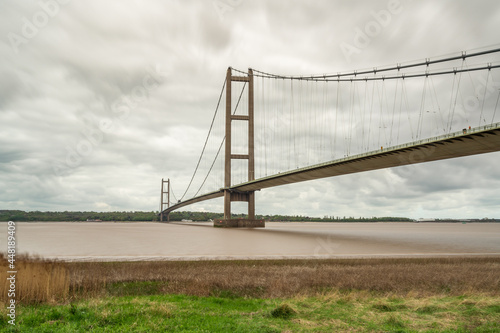 Grey clouds over the Humber Bridge, seen from Barton-Upon-Humber in North Lincolnshire, England, UK photo