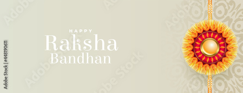 happy raksha bandhan traditional banner with realistic rakhi