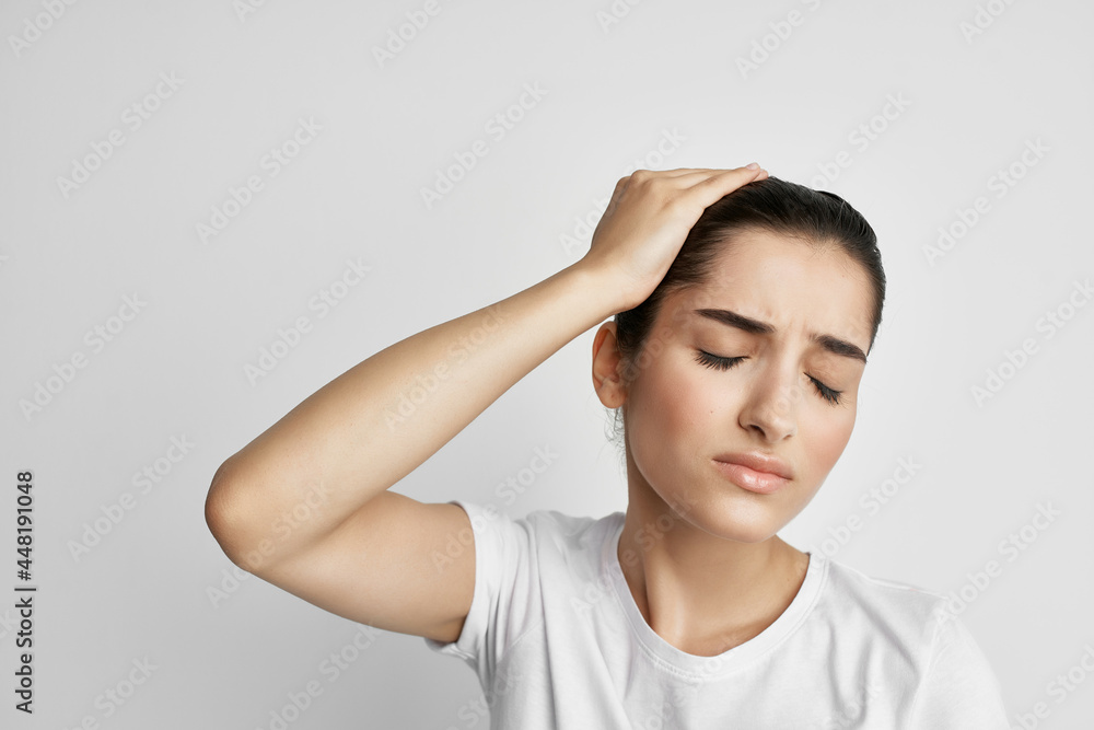 woman with headache dissatisfaction health problems medicine light background woman with headache dissatisfaction health problems medicine light background
