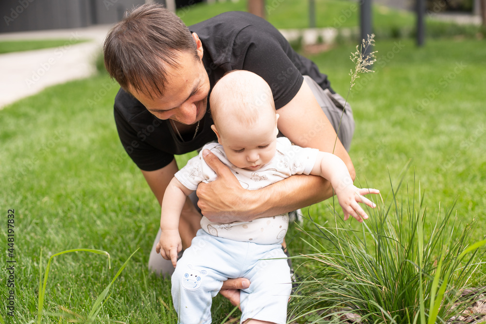Fototapeta premium Summer portrait of beautiful baby on the lawn