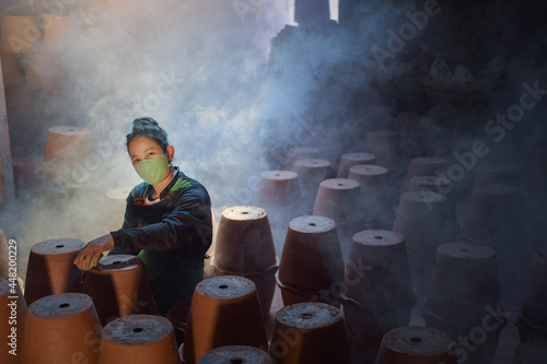 potter making pot in pottery workshop photo