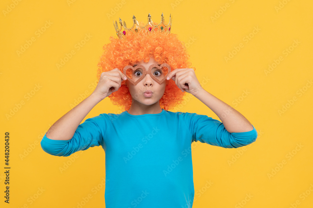just having fun. fancy party look. egocentric kid in clown wig and crown. just having fun. fancy party look. egocentric kid in clown wig and crown.