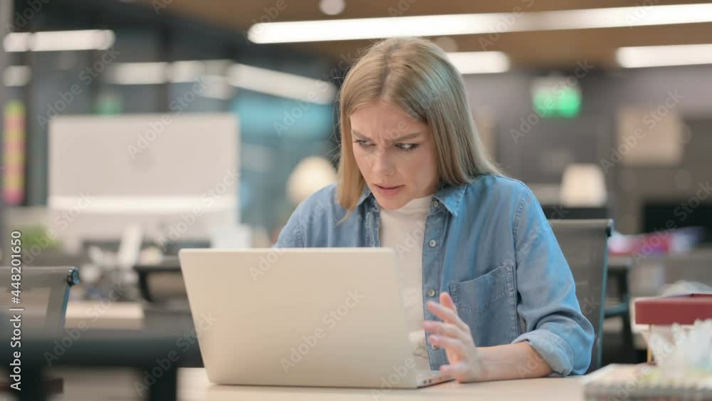 Young Woman Feeling Angry while using Laptop Young Woman Feeling Angry while using Laptop