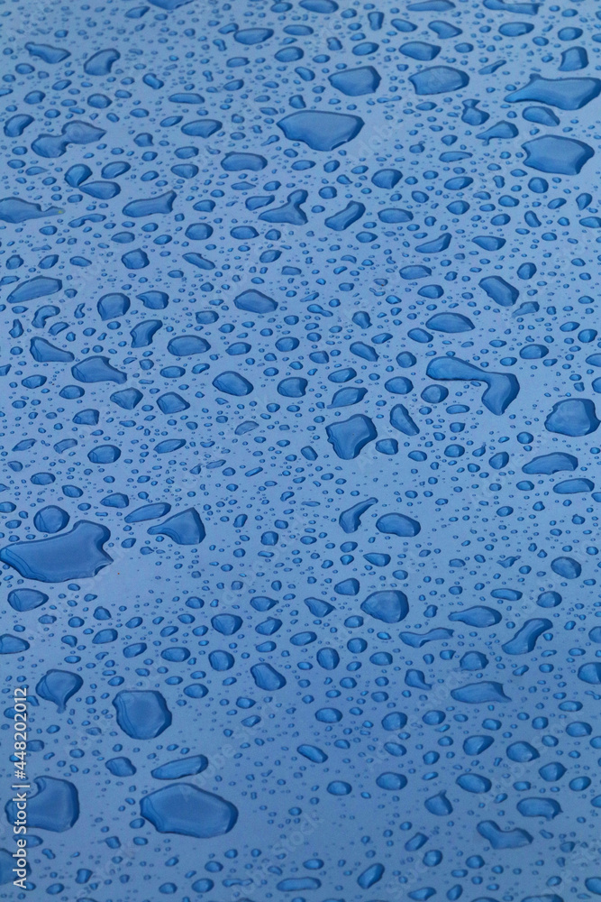 Drops of water on blue surface Drops of water on blue surface