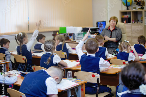 Pupils at desks in class on lesson
