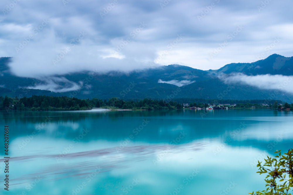 View of magic sunset over Lake Wolfgang at cloudy evening. View of magic sunset over Lake Wolfgang at cloudy evening.