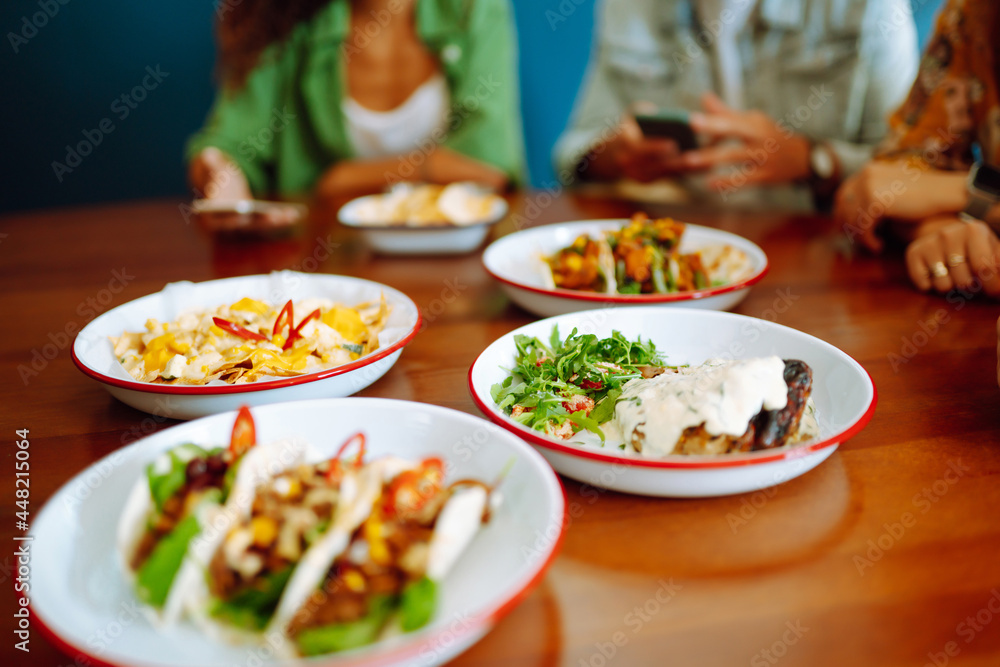 Food Table. Friendly dinner in a cafe.People, lifestyle, lunch, party, relax concept.