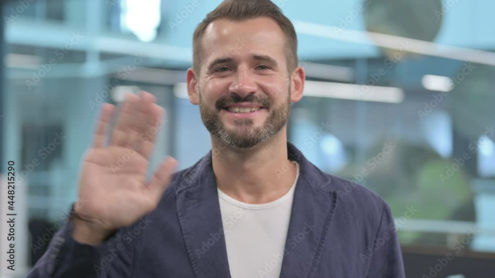 Middle Aged Businessman Waving, Welcoming Middle Aged Businessman Waving, Welcoming