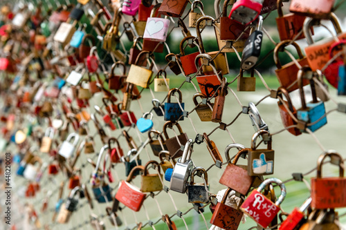 Closeup of love lockers at famous bridge Makartsteg in Salzburg, Austria. Padlocks of love on a bridge.