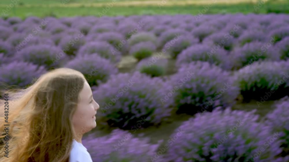 a girl in a white dress runs through a lavender field a girl in a white dress runs through a lavender field