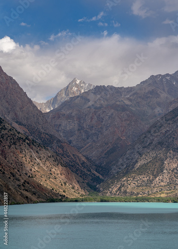 Scenic vertical mountain landscape around famous landmark Iskanderkul lake, Fann mountains, Sughd, Tajikistan