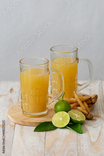 Kaempfer juice on a wooden table photo