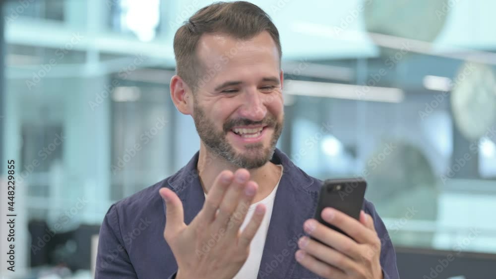 Middle Aged Businessman Celebrating on Smartphone Middle Aged Businessman Celebrating on Smartphone
