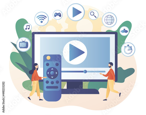 Tiny people watch video, content, applications on multimedia box tv. Smart TV and remote control. Modern television technology. Modern flat cartoon style. Vector illustration on white background