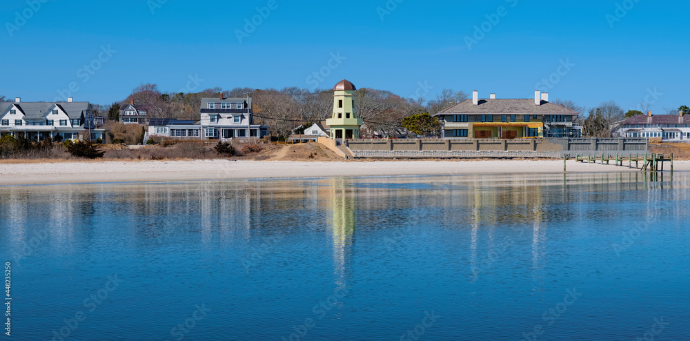Fototapeta premium Panoramic Seaside Village on the Beach with Reflections on the Sea Water