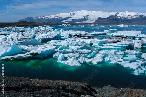 Jokulsarlon Glacier Lagoon blue-green icebergs reflected in the water in Iceland